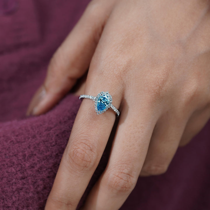  1.5ct Pear Diamond on Hand18. Blue Pear Halo Ring Inspiration19. Something Blue Engagement Ring Ideas20. Dreamy Blue Pear Diamond Ring