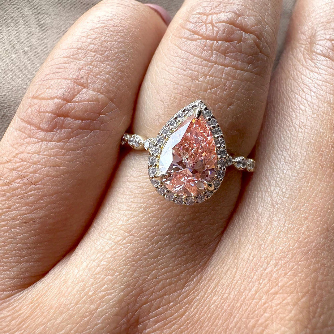 pink pear with pave band, pear cut halo setting, conflict-free pink diamond, pink anniversary ring, pink teardrop engagement ring.