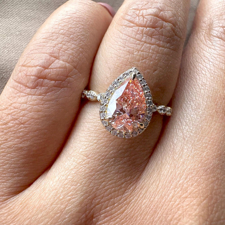 pink pear with pave band, pear cut halo setting, conflict-free pink diamond, pink anniversary ring, pink teardrop engagement ring.