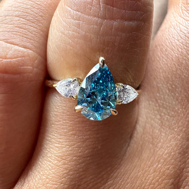 Triple Pear Cut Engagement Ring21. Blue Diamond Trilogy Aesthetic22. Dream Blue Pear Engagement Ring23. Modern Three Stone Blue Diamond