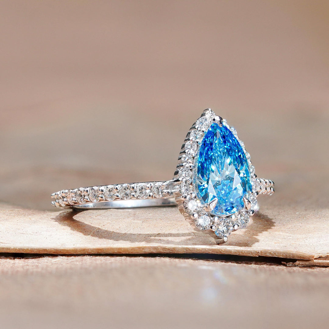 Romantic Blue Pear Halo Pave28. 1.5ct Blue Diamond Ring Style29. Pear Cut Blue Diamond Profile30. Elegant Blue Diamond Halo Setting