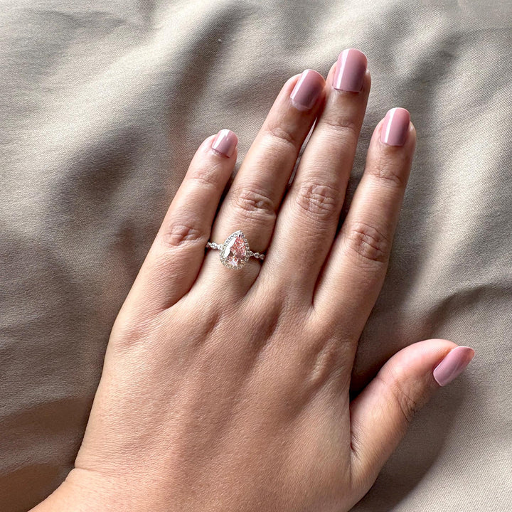 Fancy pink lab diamond, pink pear halo ring, teardrop pink diamond, pink diamond with white halo, 2 carat pear solitaire, sustainable pink diamond, pink and white diamond ring, micro pave engagement ring, fancy vivid pink diamond, pear shaped pink solitaire.