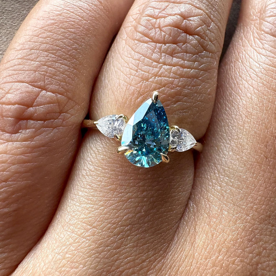 Buy blue lab diamond ring, certified blue diamond, eco-friendly engagement ring, unique blue diamond ring, affordable fancy blue diamond, bespoke three stone ring, luxury lab diamond jewelry, GIA vs IGI blue diamond, high-quality lab grown ring.
