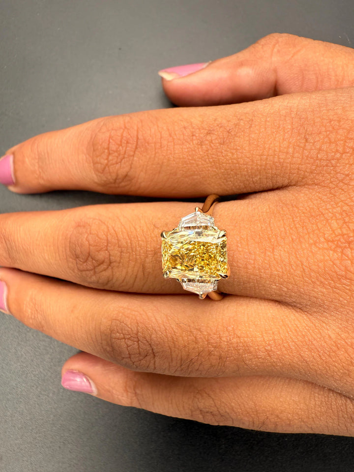 Radiant Cut with Tapered Baguettes3 Carat Radiant Diamond on HandModern Three Stone Radiant DesignYellow Radiant Ring with Pear Side Stones