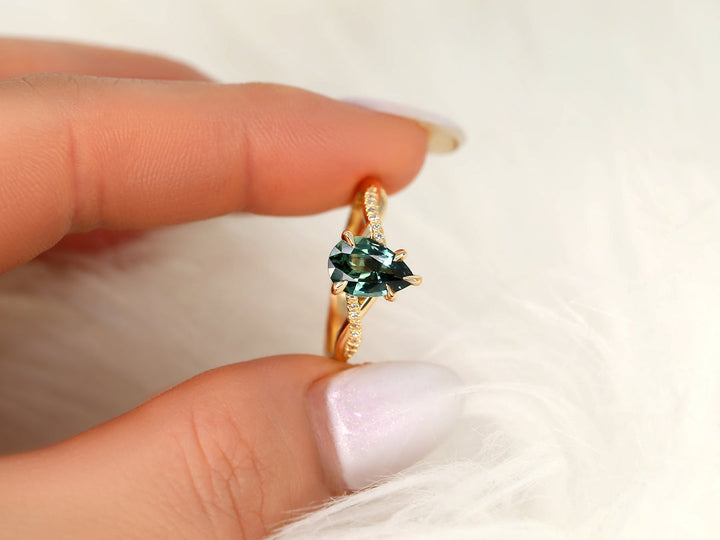 Pear Shaped Sapphire
Lab Diamond Accents
Infinity Band Ring
Teal Sapphire Jewelry
