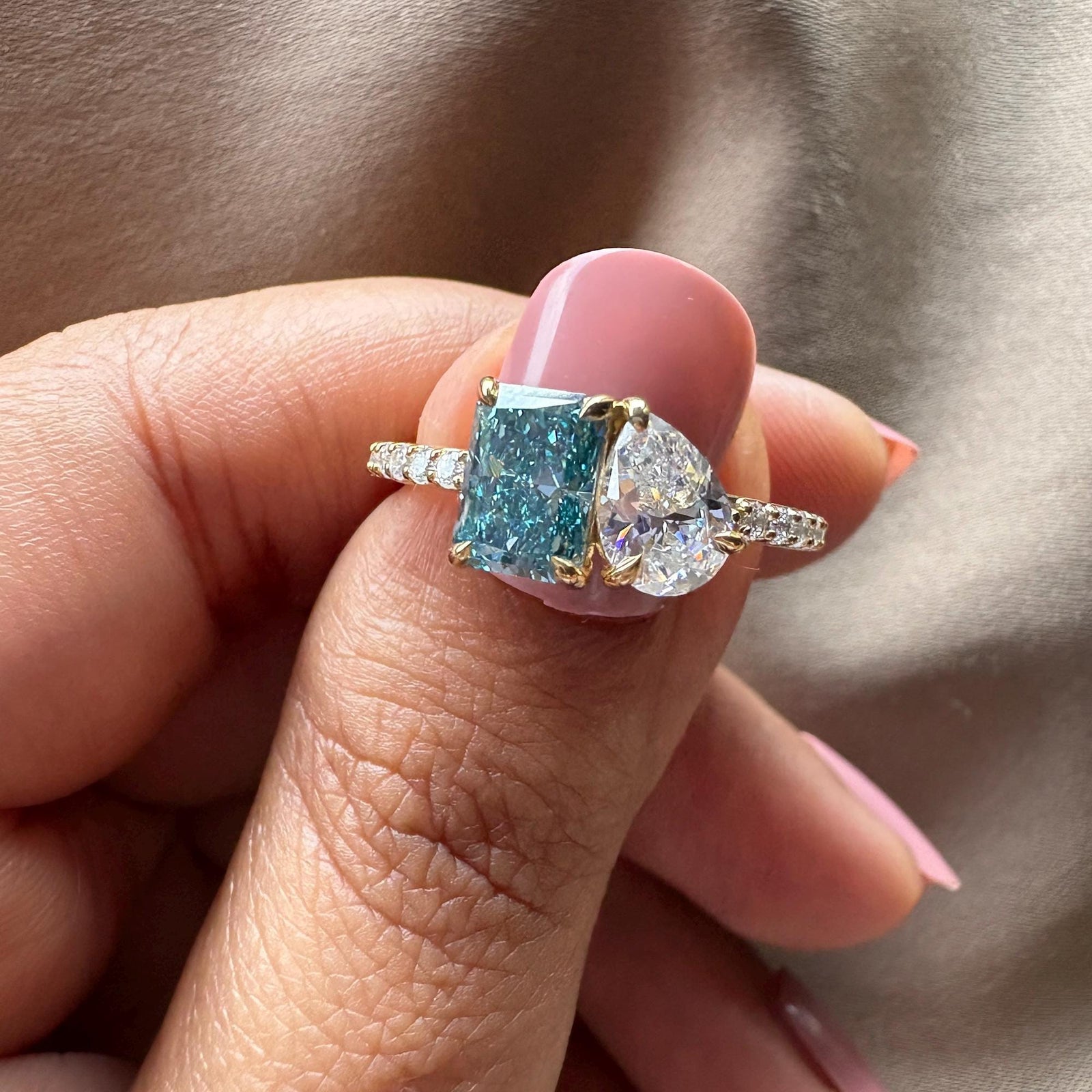 blue diamond ring, radiant cut diamond, pear shaped diamond, two stone diamond ring, ethical diamond ring,