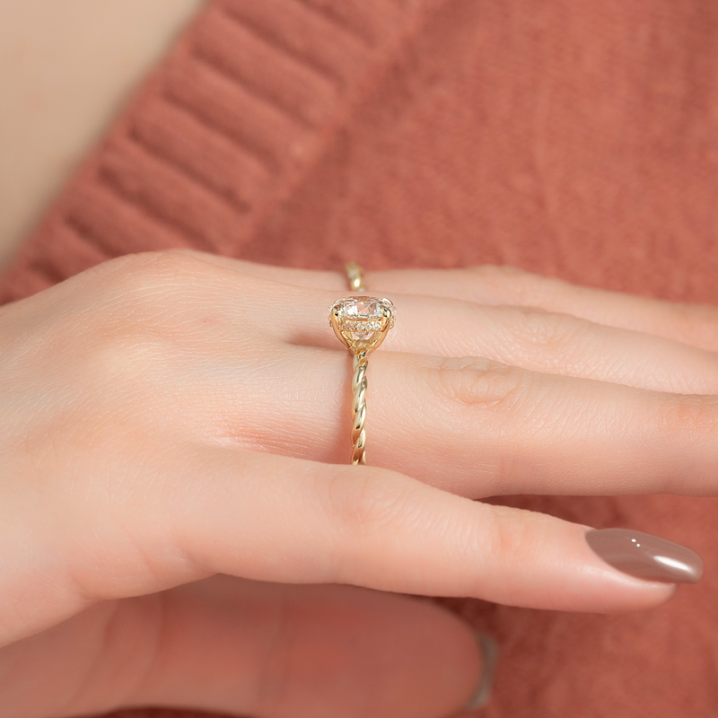 Oval cut twist engagement rings for sale, Custom braided engagement rings with hidden halo, Twisted ring vs solitaire ring comparison, Elegant braided diamond engagement rings,