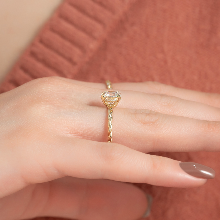 Oval cut twist engagement rings for sale, Custom braided engagement rings with hidden halo, Twisted ring vs solitaire ring comparison, Elegant braided diamond engagement rings,