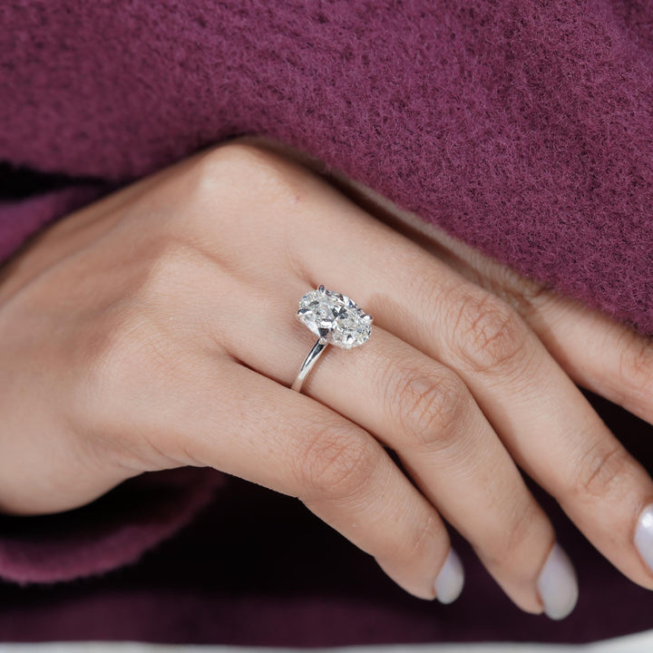 teardrop-style oval, minimal solitaire setting, 4ct lab diamond ring, oval engagement ring, high-carat lab diamond.