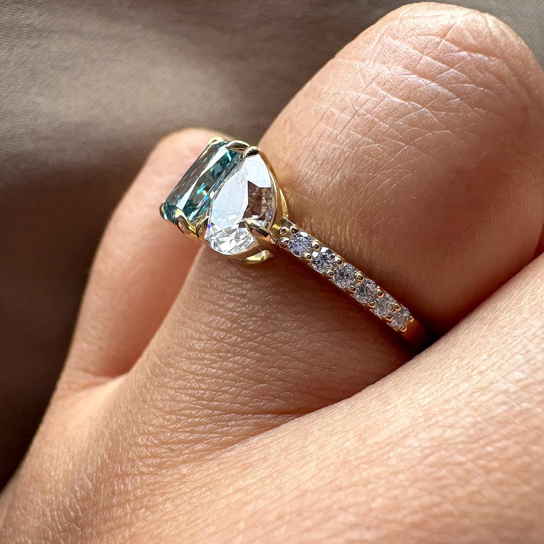 celebrity style engagement ring, unique two stone ring, blue radiant cut, teardrop diamond, fancy color lab diamond.