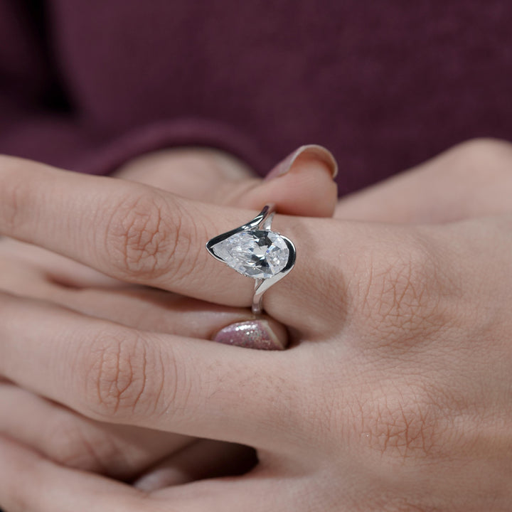 custom bypass ring, bespoke lab diamond jewelry, high quality lab grown diamond, sustainable luxury ring, pear cut engagement ring for sale.