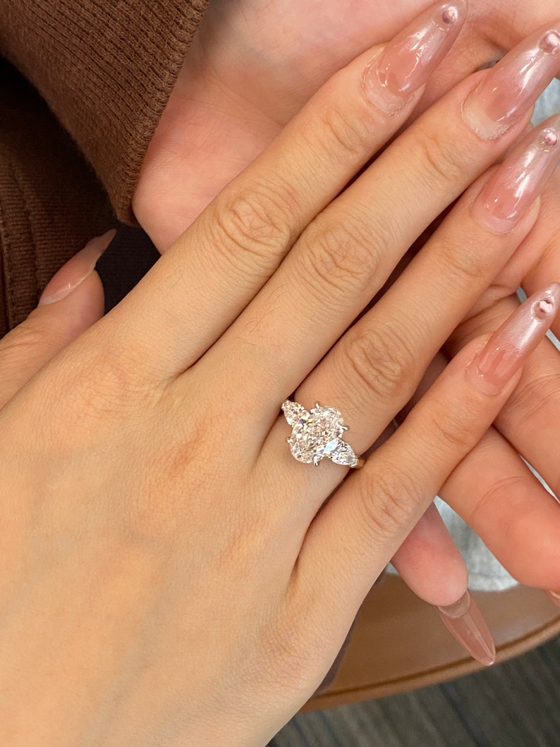 3.0ct-4.0ct Oval Cut Lab Grown Diamond Three Stone Engagement Ring