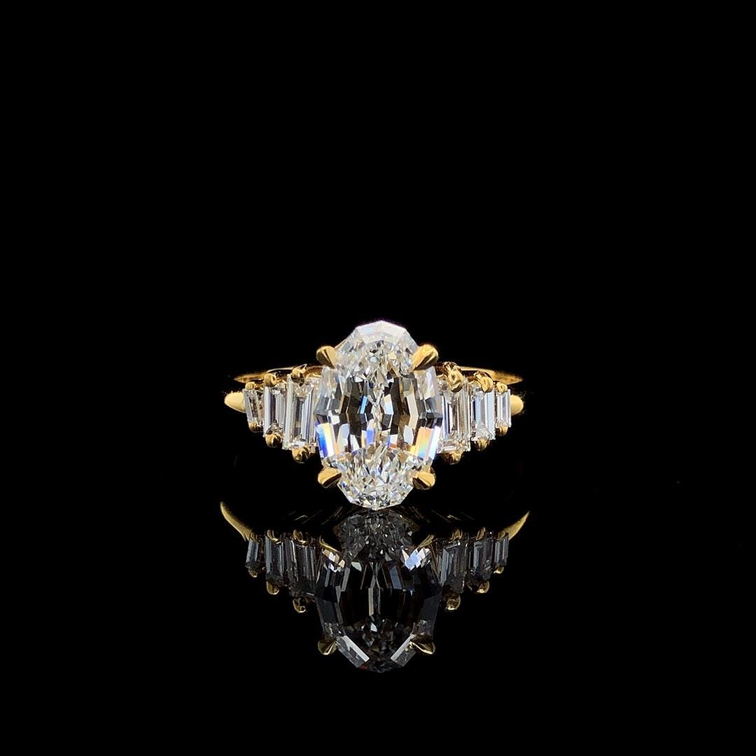 2.0CT Oval Step Cut Lab Made Diamond Engagement Ring - Graduated Baguette Setting
