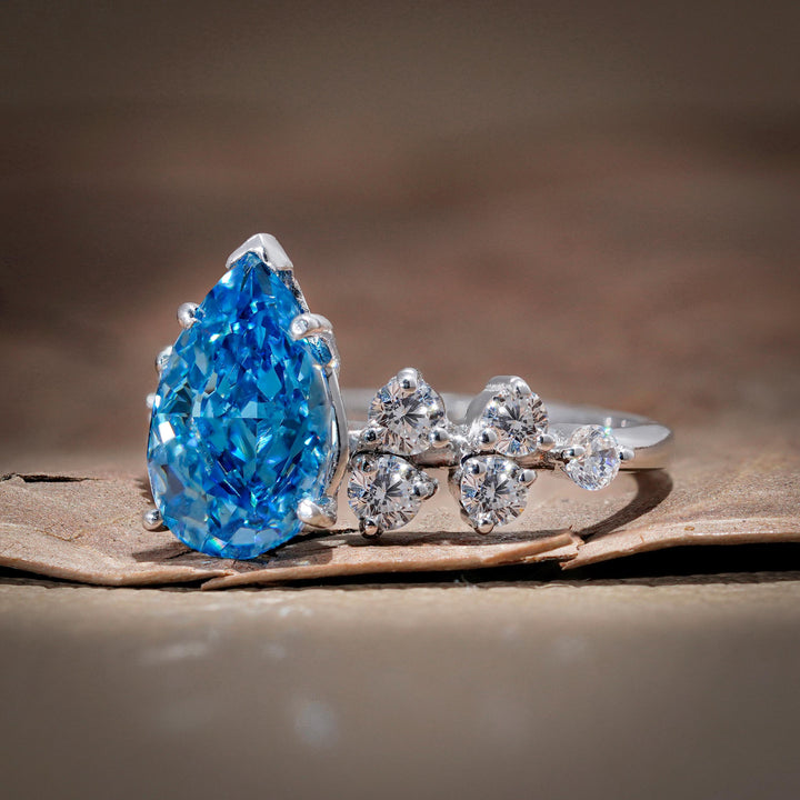 pear cluster setting, blue teardrop halo, conflict-free blue diamond, blue anniversary ring, 3 carat pear cluster.