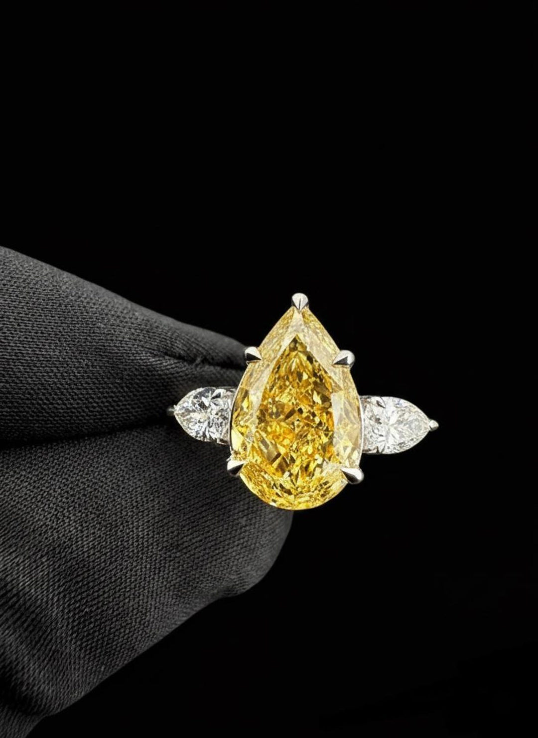 pear cut three stone engagement ring
