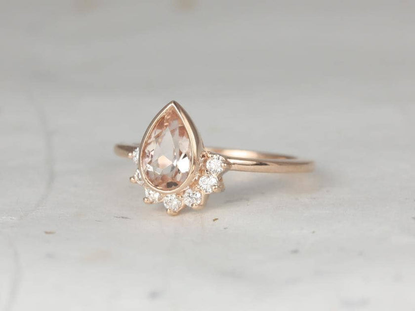 pear pink engagement ring
peach pink gemstone engagement ring
pear cut pink sapphire ring
pear shape peach engagement ring
pink diamond pear engagement ring