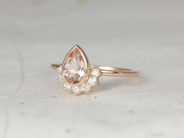 pear pink engagement ring
peach pink gemstone engagement ring
pear cut pink sapphire ring
pear shape peach engagement ring
pink diamond pear engagement ring