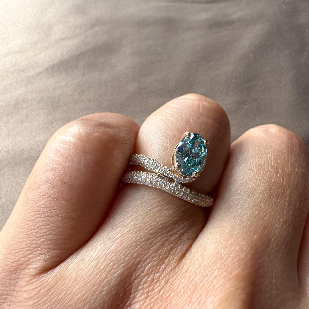 oval cut with hidden details, conflict-free blue diamond, blue anniversary ring, oval halo pave setting.