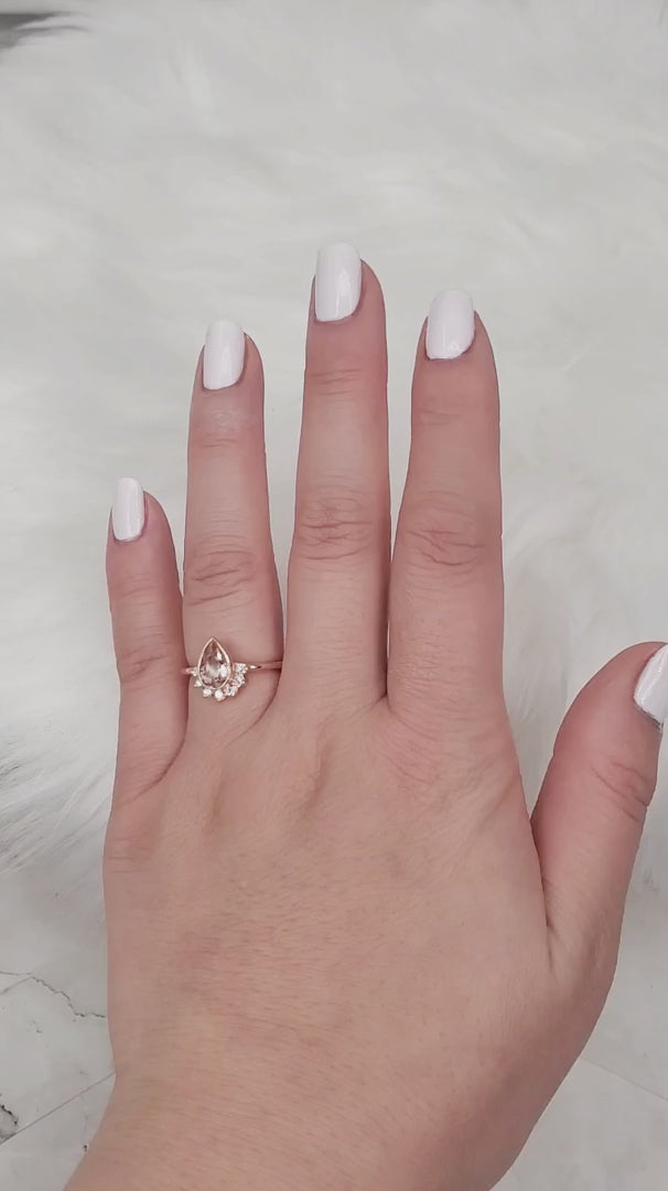 peach pink gemstone engagement ring
peachy pink engagement ring 
pink ring 
pear engagement ring 
